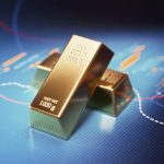 Gold bars sitting over blue financial bar graph. Selective focus. Horizontal composition with copy space. Stock market and finance concept.