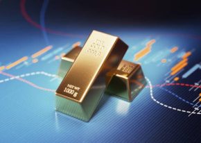 Gold bars sitting over blue financial bar graph. Selective focus. Horizontal composition with copy space. Stock market and finance concept.